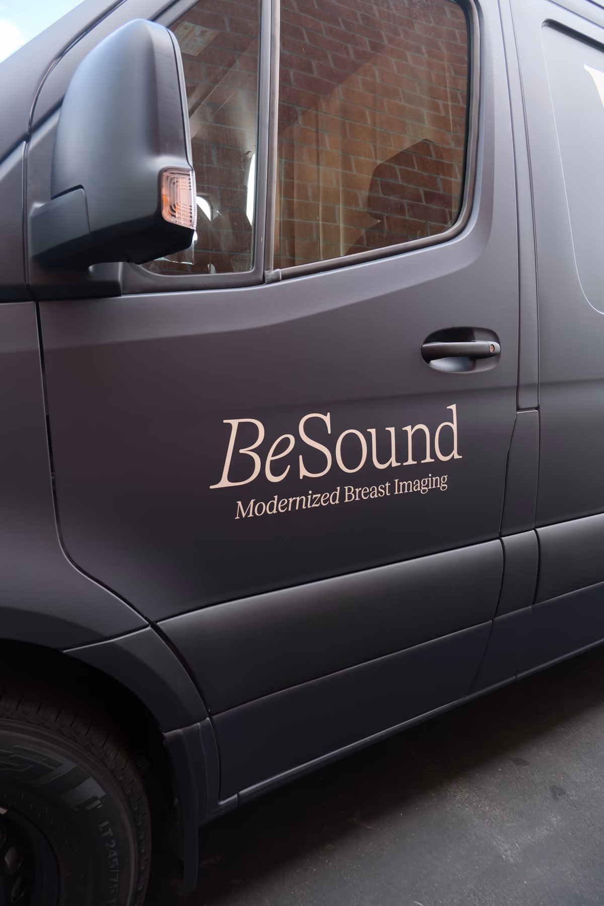 The driver's door of the BeSound Mobile van, with the BeSound logo