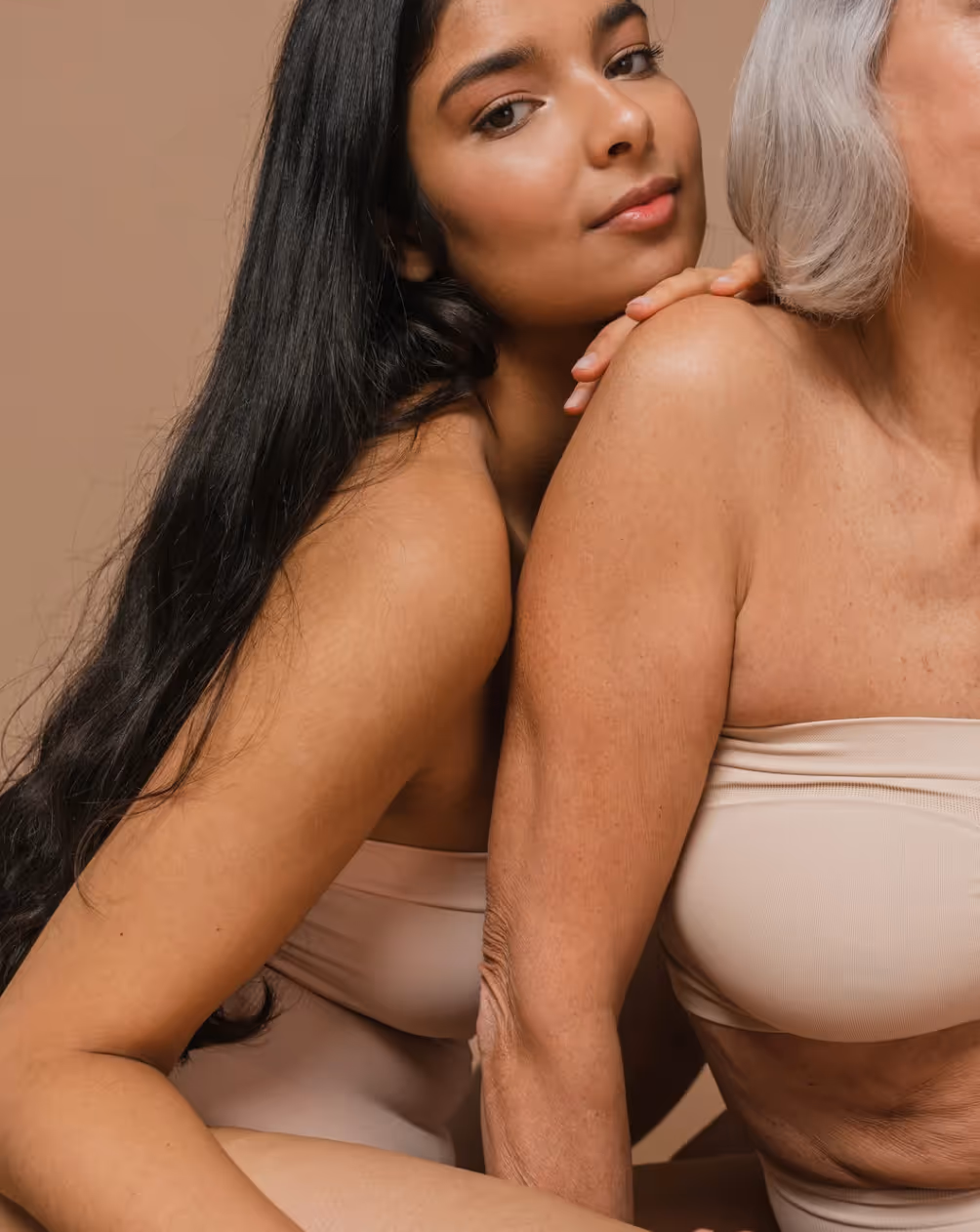 Young woman embracing older woman